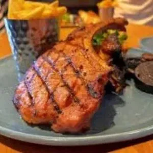 Festive-Pork-Tomahawk-Crispy-Christmas-Hash-image-harvestermenuuk.com